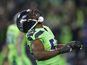 Seattle Seahawks defensive end Cliff Avril celebrates after Los Angeles Rams quarterback Jared Goff was sacked in the first half of an NFL football game, Thursday, Dec. 15, 2016, in Seattle. (AP Photo/Scott Eklund)