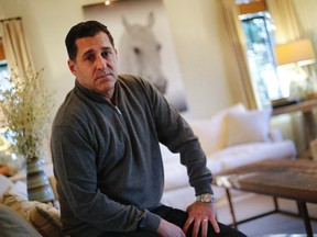 In this Thursday, Dec. 15, 2016 photo, American software company manager Bart Fanelli poses for a portrait in his home in Atlanta. Fanelli said he didn't know a British court had found that he sexually harassed a woman at a company conference until he saw his photo splashed across a British tabloid's website accusing him of saying he wanted to eat the woman "like a marshmallow." (AP Photo/John Bazemore)