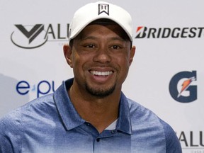 In this Oct. 20, 2015, file photo, Tiger Woods arrives for a press conference to launch Bridgestone America's Golf Cup in Mexico City. (AP Photo/Rebecca Blackwell, File)