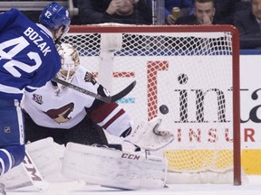 Arizona Coyotes goalie Mike Smith makes a save on Toronto Maple Leafs' Tyler Bozak during shootout NHL hockey action in Toronto, on Thursday December 15, 2016. (THE CANADIAN PRESS/Chris Young)