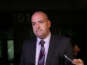 The father of a convicted killer will stand trial again for allegations of drug dealing following an appeal court ruling, vindicating Det. Const. Chris Benson (pictured in a file photo above) who was accused of misleading the court. JEAN LEVAC / POSTMEDIA