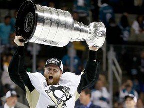 Phil Kessel of the Pittsburgh Penguins celebrates with the Stanley Cup after their 3-1 victory to win the Stanley Cup against the San Jose Sharks in Game Six of the 2016 NHL Stanley Cup Final at SAP Center on June 12, 2016 in San Jose, California. (Christian Petersen/Getty Images)