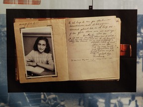 This June 12, 2009 file photo, shows a photo of Anne Frank at the opening of the exhibition: “Anne Frank, a History for Today”, at the Westerbork Remembrance Centre in Hooghalen, northeast Netherlands. (AP Photo/Bas Czerwinski, File)