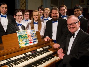 Members of the Beal Singers pose with their bearded and beaming conductor David Weaver and Trinity Lutheran church?s director of music and organist Ross McDonald, right, at the Beal secondary school?s auditorium. Along with an orchestra, the full Beal choir and community choir The London Singers ? both directed by Weaver ? will be at the auditorium Sunday for their Christmas concert. (MIKE HENSEN, The London Free Press)