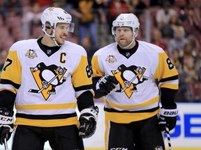 Sidney Crosby #87 and Phil Kessel #81 of the Pittsburgh Penguins talk during a game against the Florida Panthers at BB&T Center on December 8, 2016 in Sunrise, Florida. (Photo by Mike Ehrmann/Getty Images)
