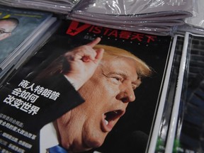 A magazine featuring U.S. President-elect Donald Trump is seen at a bookstore in Beijing. The headline reads "How will businessman Trump change the world". Beijing is "seriously concerned" by U.S. president-elect Donald Trump's suggestion that he could drop Washington's One China policy unless the mainland makes concessions on trade and other issues, it said on December 12. / AFP PHOTO / GREG BAKERGREG BAKER/AFP/Getty Images