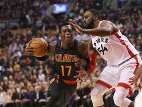 Atlanta Hawks guard Dennis Schroder (17) and Toronto Raptors forward Patrick Patterson (54) in action as the Toronto Raptors take on the Atlanta Hawks at the Air Canada Centre, in Toronto, Ont. on Friday December 16, 2016. Stan Behal/Toronto Sun/Postmedia Network