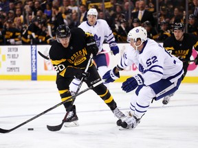 Martin Marincin #52 of the Toronto Maple Leafs defends Riley Nash #20 of the Boston Bruins during the first period at TD Garden on December 10, 2016 in Boston, Massachusetts. (Photo by Maddie Meyer/Getty Images)