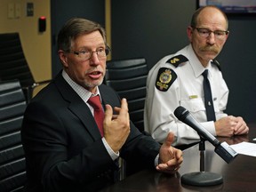 Edmonton Police Service detective Guy Pilon and superintendent David Veitch talk about the Edmonton Police Service’s position on supervised injection sites at police headquarters in Edmonton on December 16, 2016. LARRY WONG / POSTMEDIA