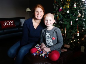 Seven-and-a-half-year-old Marlow Ploughman and mom Tanya Boehm pose for a photo inside their home, Friday December 16, 2016 near Belleville, Ont. 
Emily Mountney-Lessard/Belleville Intelligencer/Postmedia Network