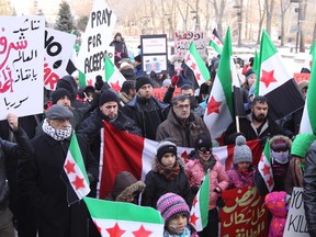 A few hundred people gathered in front of the Alberta Legislature on Dec. 17, 2016, to call on the Canadian government to offer more humanitarian support to civilians suffering from conflict in Syria.