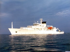 In this undated photo released by the U.S. Navy Visual News Service, the USNS Bowditch, a T-AGS 60 Class Oceanographic Survey Ship, sails in open water. The USNS Bowditch, a civilian U.S. Navy oceanographic survey ship, was recovering two drones on Thursday when a Chinese navy ship approached and sent out a small boat that took one of the drones, said Navy Capt. Jeff Davis, a Pentagon spokesman. He said the Chinese navy ship acknowledged radio messages from the Bowditch, but did not respond to demands the craft be returned. (CHINFO, Navy Visual News via AP)