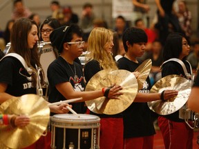 Members of the Rebel Thunder drumline entertain during a previous  REB Invitational Basketball Tournament at Jasper Place High School.   Greg Southam