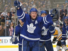 Morgan Rielly of the Toronto Maple Leafs celebrates an overtime winning goal by teammate Jake Gardiner against the Pittsburgh Penguins during an NHL game at the Air Canada Centre on December 17, 2016 in Toronto, Ontario, Canada. (Claus Andersen/Getty Images)