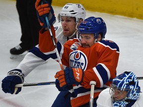 Edmonton Oilers forward Taylor Beck and Tampa Bay Lightning's Braydon Coburn battle in front of goalie Ben Bishop at Rogers Place on Saturday, Dec. 17, 2016. (Ed Kaiser)