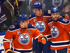 Edmonton Oilers Milan Lucic (27) celebrates his goal with Connor McDavid (97) and Mark Letestu (55) against the Tampa Bay Lightning during second period NHL action at Rogers Place in Edmonton, Saturday, December 17, 2016. Ed Kaiser/Postmedia