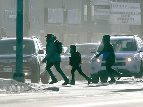 Cold weather leads many people to start their vehicles, then head back inside. That's a mistake, say police. (Winnipeg Sun/Postmedia Network)