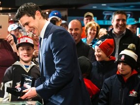 Pittsburgh Penguin Sidney Crosby holds a 2016 Stanley Cup ring at the Hockey Hall of Fame on Yonge St. (ERNEST DOROSZUK, Toronto Sun)