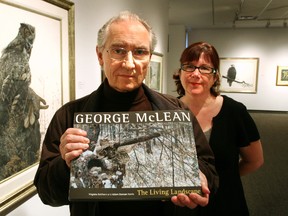 Renowned Canadian artist George McLean and Virginia Eichhorn, Director Curator of the Tom Thomson Gallery, with the new book of his paintings. (JAMES MASTERS/QMI AGENCY/THE SUN TIMES)