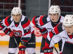 Ottawa 67's players Jared Steege, Carter Robertson and Ben Evans line up against the Peterborough Petes at TD Place arena in Ottawa on Dec. 11, 2016. (Ashley Fraser/Postmedia)