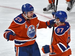 Leon Draisaitl and Connor McDavid celebrate Draisaitl's game-tying goal against the Lightning Saturday at Rogers Place. (Ed Kaiser)