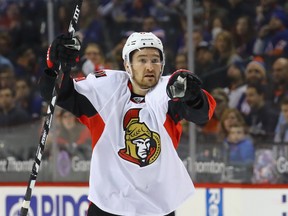 Mark Stone of the Ottawa Senators points at teammate Zack Smith during an NHL game against the New York Islanders in New York on Dec. 18, 2016. (Bruce Bennett/Getty Images)