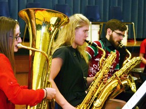 The Mitchell District High School (MDHS) bands hosted the school's annual Christmas Concert, entitled “We Wish You...” last Friday, Dec. 16. Up first, the MDHS Concert Band performed a number of seasonal songs, some old favourites, and even a few contemporary pieces. Pictured, Myah Vingerhoeds (left) on tuba, and Elisa Bolinger and Jacob Vorstenbosch on baritone saxophone provide the booming bass notes for the song “Visions of Glory.” GALEN SIMMONS MITCHELL ADVOCATE