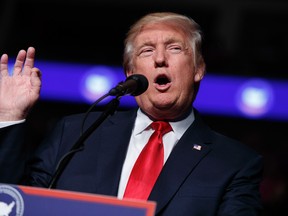 In this Thursday, Dec. 15, 2016, file photo, President-elect Donald Trump speaks during a rally at the Giant Center in Hershey, Pa. Trump's closest advisers see Democrats' complaints that Moscow hacked their private emails this election season as a case of sour grapes. The pushback comes ahead of the Electoral College vote, Monday, Dec. 19, which is expected to make official Trump's election win. (AP Photo/Evan Vucci, File)