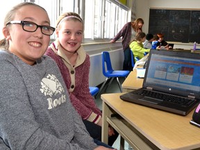 During the twice postponed Hour of Code in Mitchell District High School (MDHS) teacher Michelle McDonald's Grade 8 class Dec. 16, Emma Collings (left) and Hannah Elliott had the chance to learn coding on a program called Scratch, where they were able to maneuver an on-screen character using basic coding language. GALEN SIMMONS MITCHELL ADVOCATE