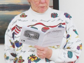 Pembina Crisis Connections Society board chair Dianne Nikiforuk leads the memorial service at the former Norquest College building.