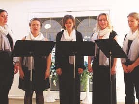 Members of the Bella Voce choir leant their voices to the first annual Tinsel and Tears memorial service held at  the Tinant Funeral Chapel on December 6. Accompanying the choir on piano was Janis Zalitach.