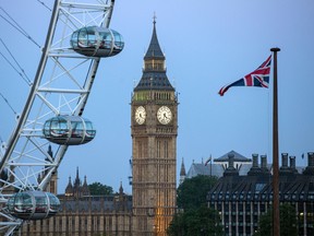A Union flag flies beside the London Eye in front of the Queen Elizabeth Tower (Big Ben) and The Houses of Parliament in London on June 24, 2016. (Getty Images)