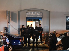 Police secure the area in front of the Islamic centre, in Zurich, Monday, Dec. 19, 2016. (Ennio Leanza/Keystone via AP)