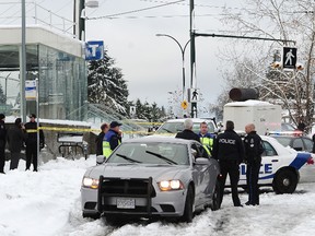 Vancouver Police and transit officials on scene at the 29th St. Skytrain station in Vancouver December 19, 2016. (NICK PROCAYLO/PostMedia Network)