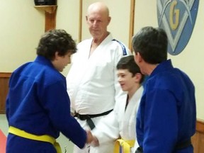 Ten-year-old Reily Manery (second right) receives the QJC' s prestigious Judoka of the Year award for 2016 during a recent club ceremony in Frankford. (Submitted photo)