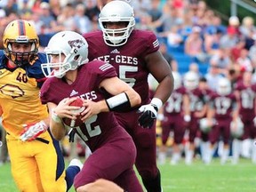 Belleville's Derek Wendel carries the ball for the Ottawa Gee Gees vs. the Queen's Golden Gaels during the 2016 OUA football season. (OUA photo)