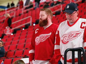 Detroit Red Wings fans look out over the ice following the cancellation of the Red Wings game with the Carolina Hurricanes due to a problem with the ice in the PNC Arena on Dec. 19, 2016, in Raleigh, N.C. (AP Photo/Karl B DeBlaker)