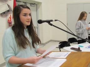 Jenna Duarte, 13, speaks Monday in the school gym at P.E. McGibbon Public School in Sarnia, as president of its newly chartered Builders Club. The leadership-building club is sponsored by the Golden K Kiwanis Club of Sarnia-Lambton. Paul Morden/Sarnia Observer