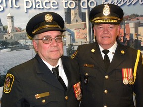 Ernst Kuglin/The Intelligencer
Quinte West fire Chief John Whelan (right) with volunteer veteran of the department Brian Mikel Monday night. Mikel was presented with his 45-year service bar during Monday’s city council meeting. Presentations were also made to recognize volunteers for the long service to the department and the city.