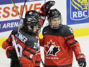 Team Canada celebrates Rebecca Johnston's first-period goal against Team USA during an exhibition game between the two national women's hockey teams at Progressive Auto Sales Arena on Monday, Dec. 19, 2016 in Sarnia, Ont. Johnston, right, scored her fourth goal of the two-game series. Terry Bridge/Sarnia Observer/Postmedia Network