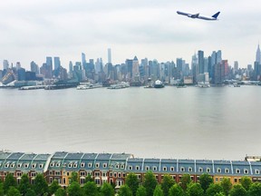 Amazing view of New York City featuring an airplane, The Empire State Building and skyline. Taken from Hamilton Park, New Jersey. (TriggerPhoto/Getty Images)