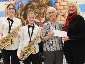 Seaway Kiwanis Club of Sarnia-Lambton's Donna Kelso presented two new saxophones  to the Lakeroad Lions Band on Wednesday, Dec. 14, following the band's holiday concert. From left to right: Amy Schmidt (senior band), Charlize Wildschut (junior band), Marion Watt (Lakeroad Lions Band treasurer) and Donna Kelso (President of the Seaway Kiwanis Club of S-L). 
submitted photo for SARNIA THIS WEEK