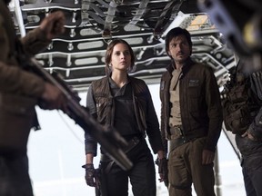 Rebels take up arms in "Rogue One: A Star Wars Story," starring Jyn Erso (Felicity Jones, centre) and Cassian Andor (Diego Luna). (Jonathan Olley-Lucasfilm-Walt Disney Studios Motion Pictures)