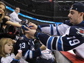 Nic Petan signs autographs during the Winnipeg Jets annual skills competition last Friday. (Kevin King/Winnipeg Sun)