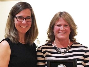 Local basketball official Steph Manderville (left) presents the Quinte Basketball Person of the Year award for 2016 to Deb Clare. (Submitted photo)