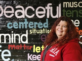 Luke Hendry/The Intelligencer
Counsellor Caitlin Moynes stands in a hallway outside the Canadian Mental Health Association offices in Belleville, Ont. Tuesday, December 20, 2016. She said people who are sad or lonely at Christmas, but who make the effort to reach out for help or take part in community events, are usually glad they did.
