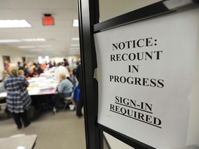 Workers recount Berrien County presidential ballots Wednesday, Dec. 7, 2016, at the South County Courthouse in Niles, Mich. A federal judge could decide whether to end Michigan's presidential recount after the state's second-highest court said the Green Party nominee was ineligible to seek a second look at millions of ballots. (Don Campbell/The Herald-Palladium via AP)