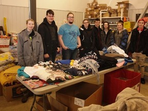 Vermilion Outreach students help load Santa Anonymous hampers at the ATCO Electric building on Thursday, December 15, 2016, in Vermilion, Alta.  Taylor Hermiston/Vermilion Standard/Postmedia Network.