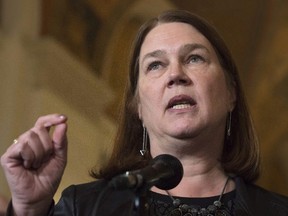 Health Minister Jane Philpott speaks with the media during a break in meetings at the Finance Ministers meeting in Ottawa, Monday, December 19, 2016. Philpott has been cleared of any ethics breach over her use of a driving service owned by one of her campaign volunteers. THE CANADIAN PRESS/Adrian Wyld