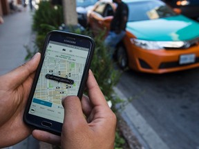Ordering an Uber could become something Winnipeggers can do, if a new report's recommendations are adopted. (Craig Robertson/Postmedia Network file photo)